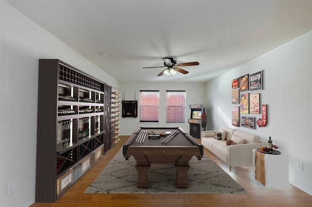 game room with ceiling fan, pool table, and light hardwood / wood-style flooring