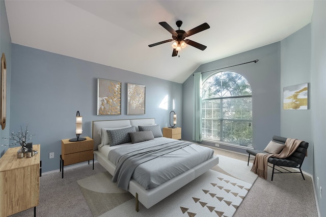 carpeted bedroom featuring vaulted ceiling and ceiling fan