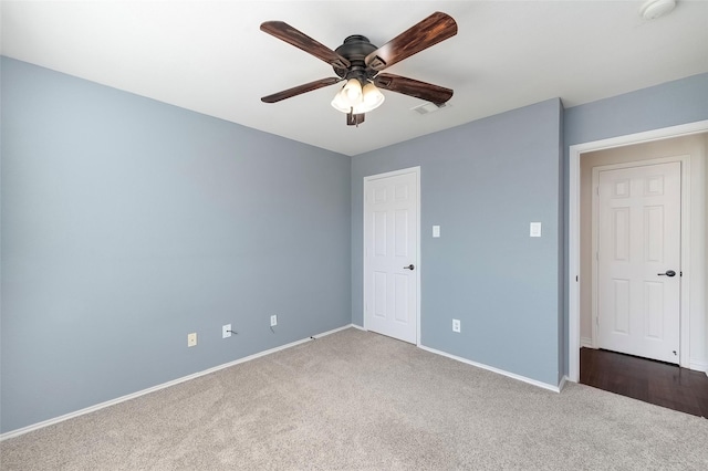 unfurnished bedroom with carpet floors and ceiling fan