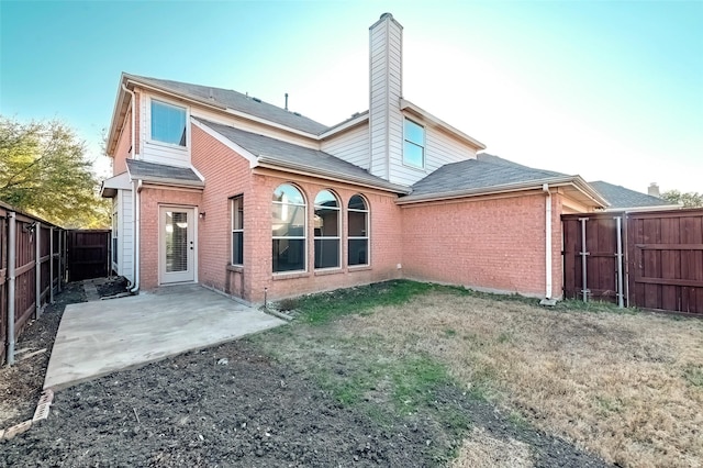 rear view of house with a patio