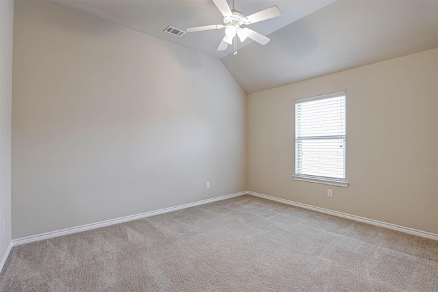 unfurnished room featuring vaulted ceiling, light carpet, and ceiling fan