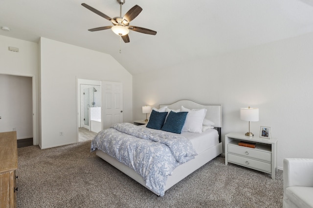 carpeted bedroom featuring lofted ceiling, connected bathroom, and ceiling fan