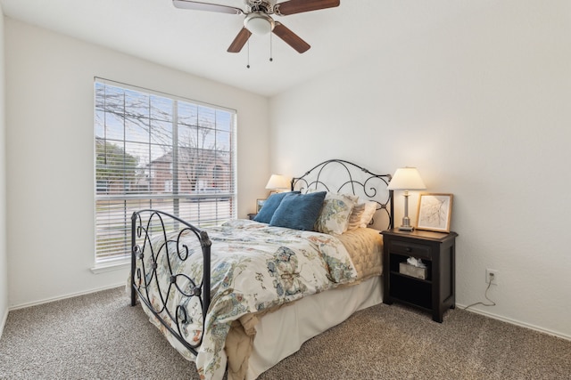 bedroom with ceiling fan and carpet flooring