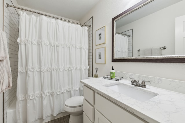 full bathroom with vanity, toilet, and shower / bath combo with shower curtain