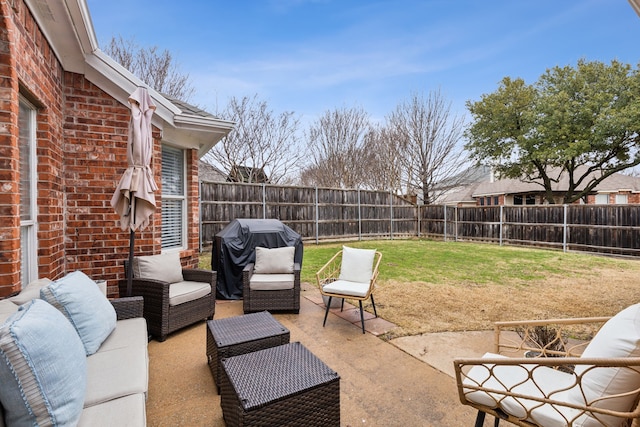 view of patio with an outdoor living space and area for grilling