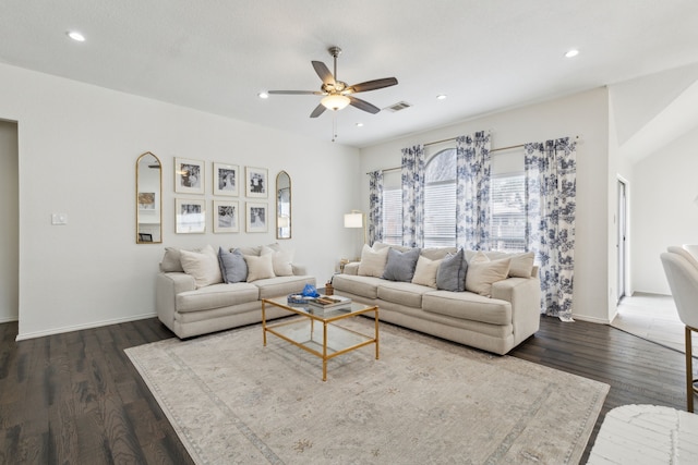 living room featuring dark hardwood / wood-style floors and ceiling fan