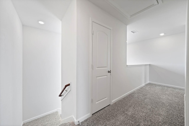 hallway with carpet floors