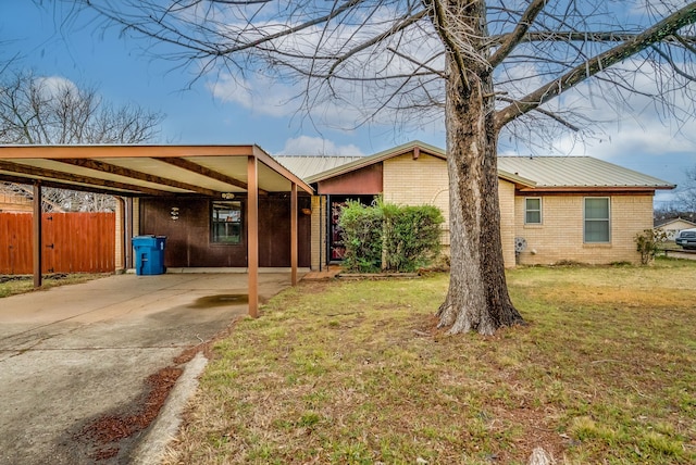 view of property exterior featuring a carport and a lawn