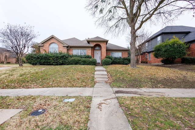 view of front of home with a front lawn