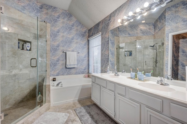 bathroom with plus walk in shower, lofted ceiling, vanity, tile patterned floors, and a textured ceiling