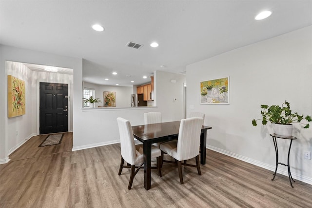 dining room featuring light wood-type flooring