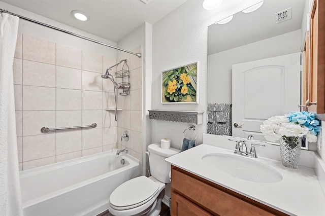 full bathroom with shower / bathtub combination with curtain, vanity, and toilet