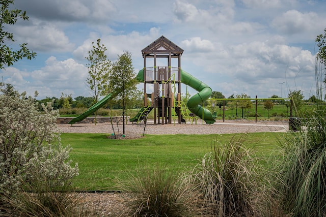 view of jungle gym with a lawn