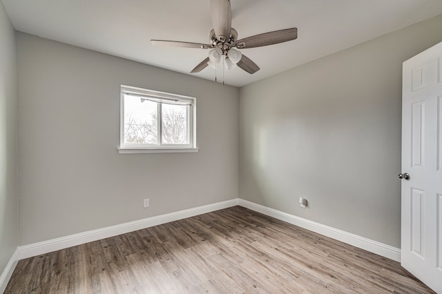 empty room with ceiling fan and light wood-type flooring