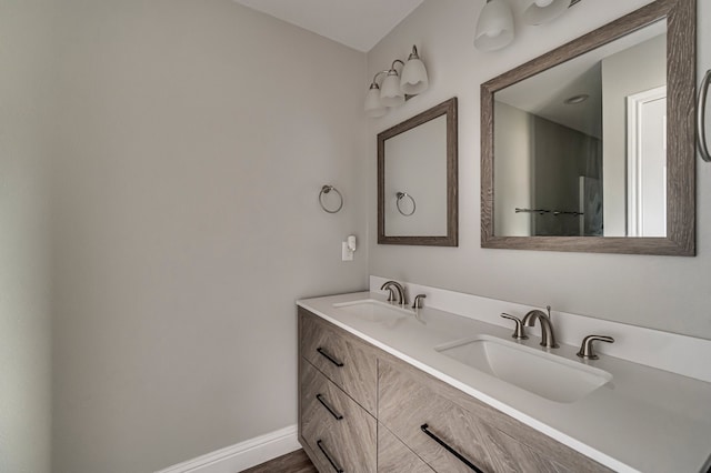 bathroom with vanity and hardwood / wood-style flooring