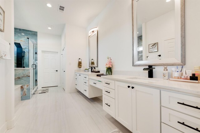 327 Lovers Ln, Terrell, TX 75160 - bathroom with visible vents, a stall shower, vanity, baseboards, and recessed lighting