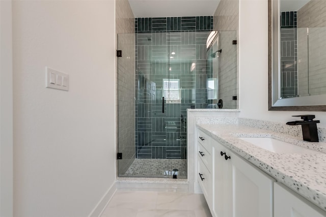 327 Lovers Ln, Terrell, TX 75160 - bathroom featuring vanity, baseboards, marble finish floor, and a stall shower