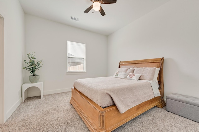 327 Lovers Ln, Terrell, TX 75160 - carpeted bedroom with baseboards, visible vents, and ceiling fan