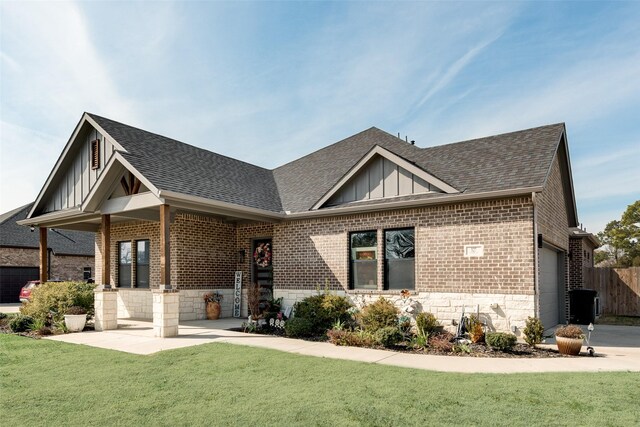 327 Lovers Ln, Terrell, TX 75160 - craftsman house featuring brick siding, a front lawn, board and batten siding, and fence