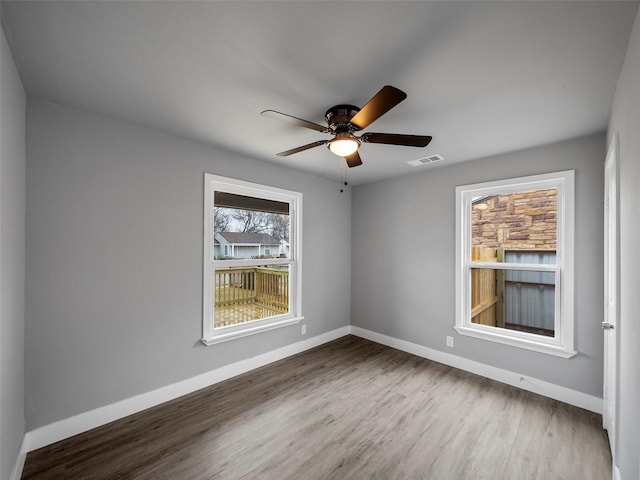 unfurnished room featuring wood-type flooring and ceiling fan