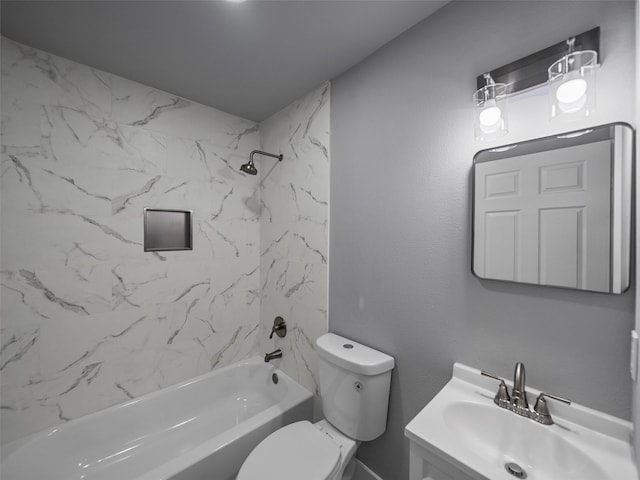 full bathroom with vanity, toilet, and tiled shower / bath