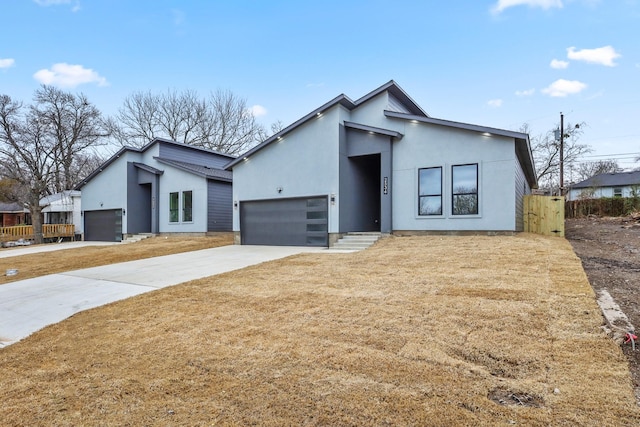 view of front of home featuring a garage and a front lawn