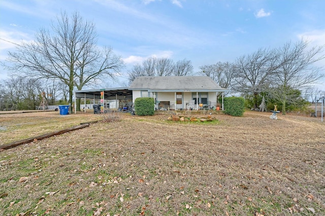 back of property featuring a porch