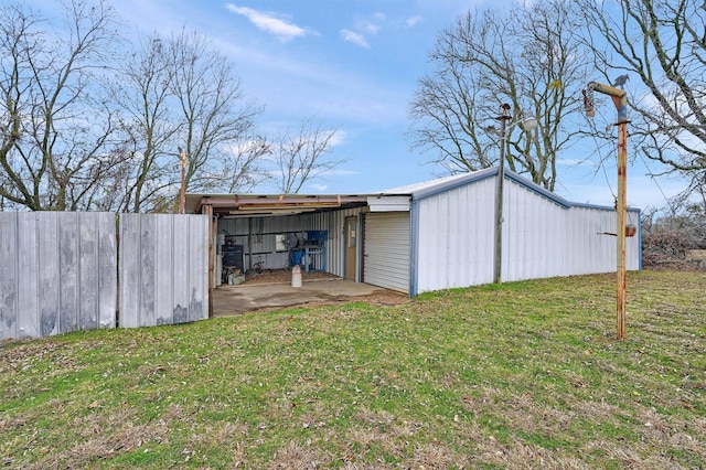 view of outbuilding with a yard