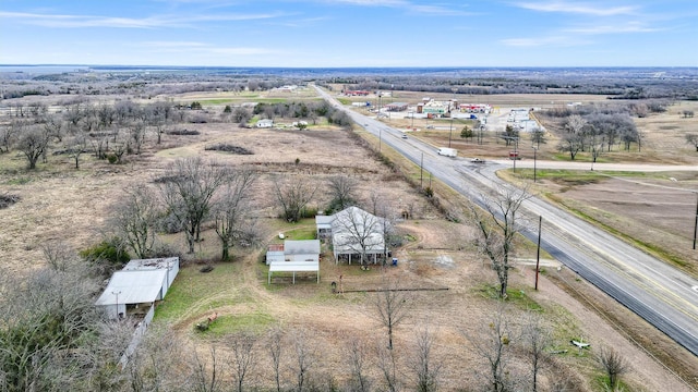 birds eye view of property featuring a rural view