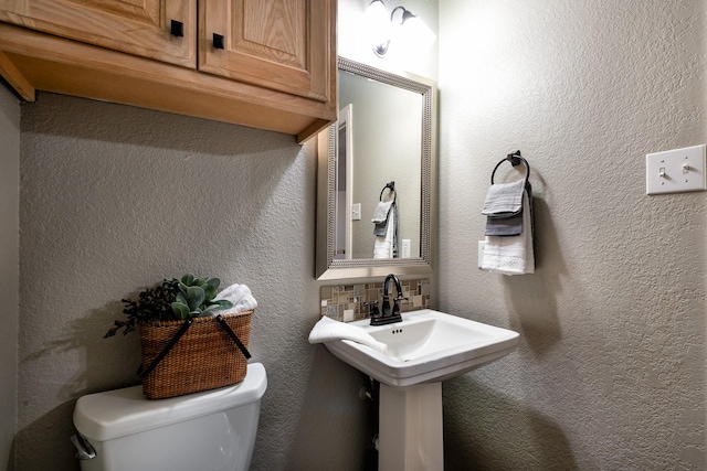 bathroom with sink and toilet