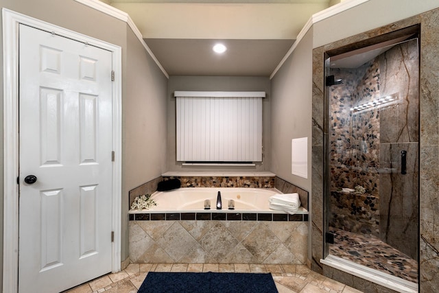 bathroom with crown molding and separate shower and tub