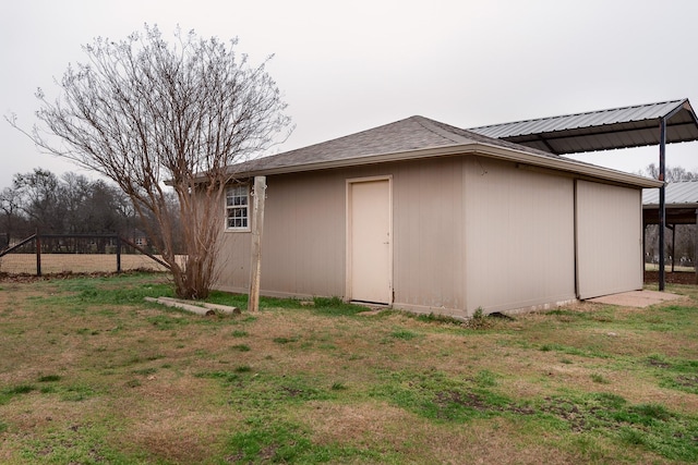 view of outdoor structure featuring a lawn