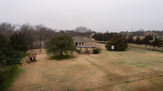 view of yard with a rural view