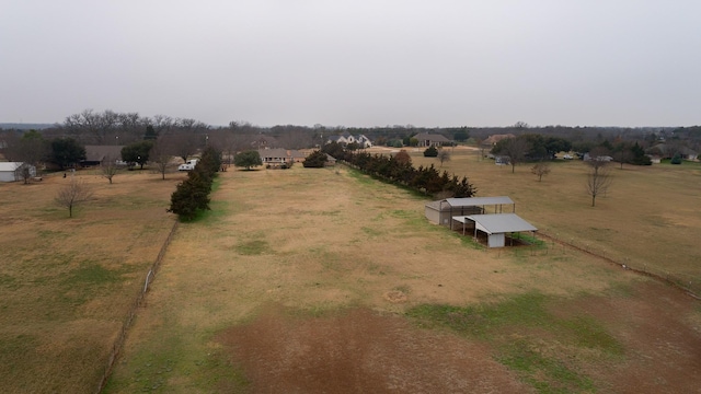 birds eye view of property featuring a rural view