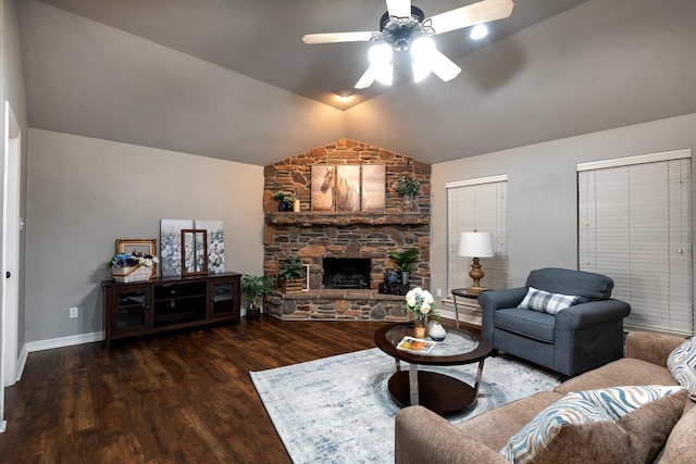 living room with a fireplace, dark wood-type flooring, vaulted ceiling, and ceiling fan