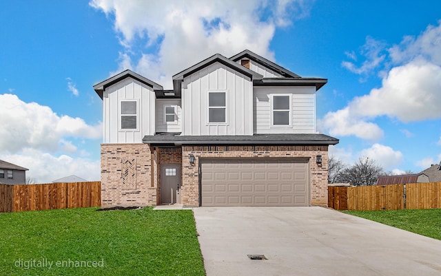 view of front of home with a garage and a front yard