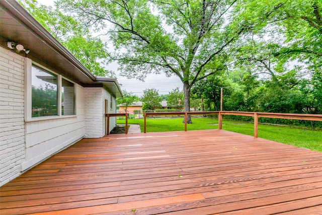 deck featuring a yard