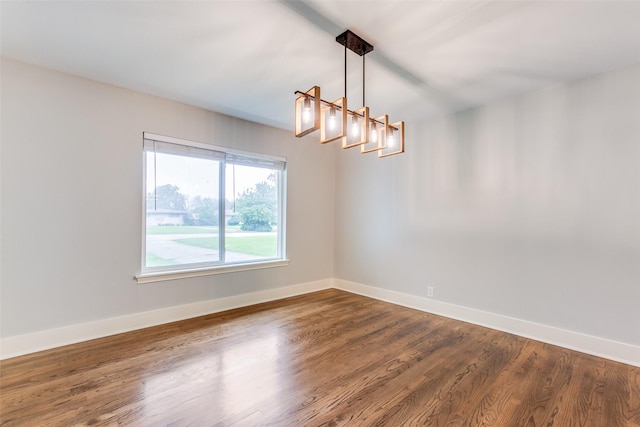 spare room featuring dark hardwood / wood-style floors