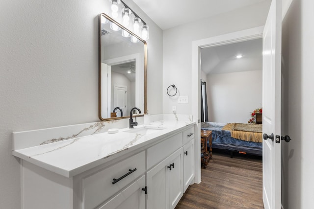 bathroom with hardwood / wood-style flooring and vanity