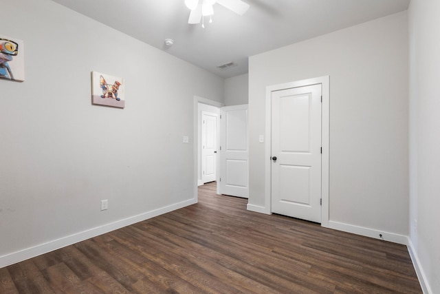 unfurnished bedroom with dark hardwood / wood-style floors and ceiling fan