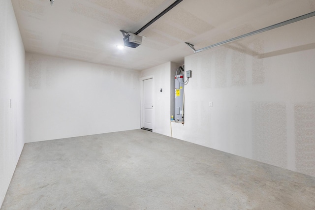 garage with water heater and a garage door opener