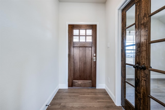 foyer with dark hardwood / wood-style floors