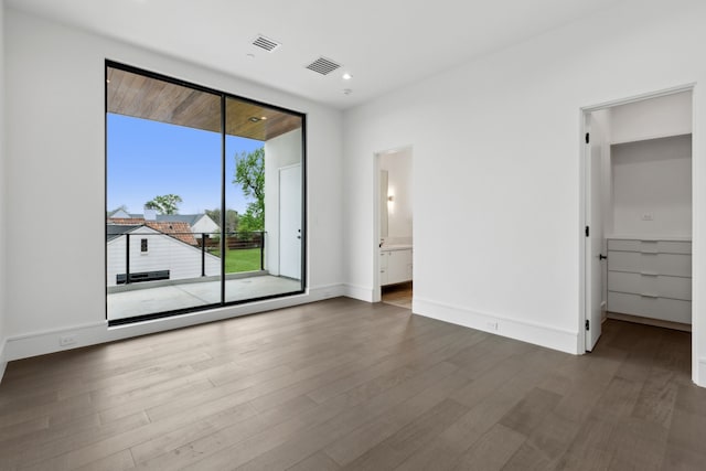 10335 Lennox Ln, Dallas, TX 75229 - unfurnished bedroom with recessed lighting, access to outside, visible vents, and wood finished floors