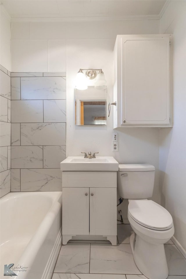 bathroom with vanity, ornamental molding, and toilet