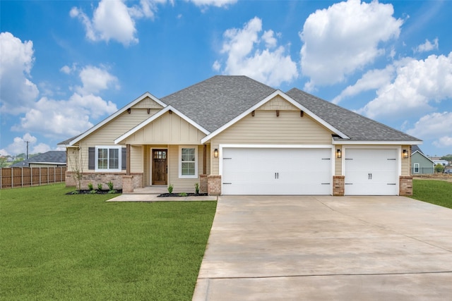 craftsman house featuring a garage and a front yard