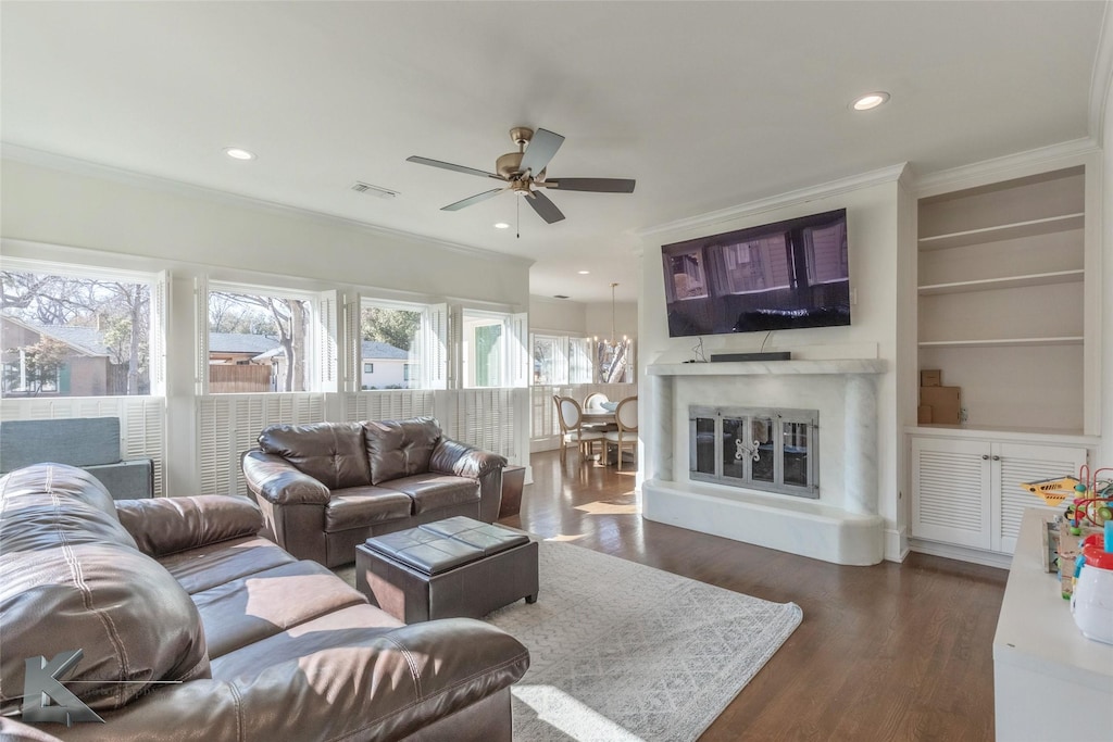 3541 Edgewood Dr, Abilene, TX 79605 - living area featuring dark wood-type flooring, recessed lighting, visible vents, and ornamental molding