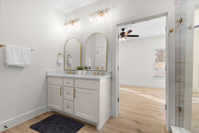 bathroom featuring vanity, hardwood / wood-style floors, and ceiling fan