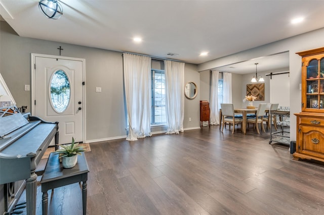 entrance foyer with dark hardwood / wood-style floors