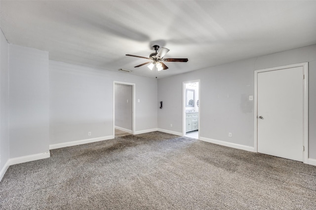 spare room featuring carpet flooring and ceiling fan