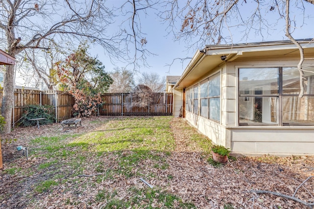 view of yard featuring a sunroom